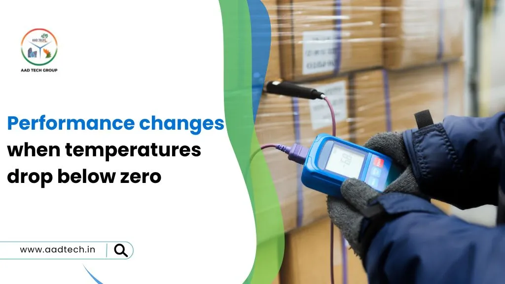 A gloved technician using a handheld meter in a cold storage warehouse